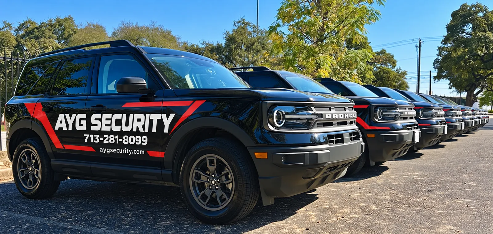 Row of AYG Security marked patrol vehicles